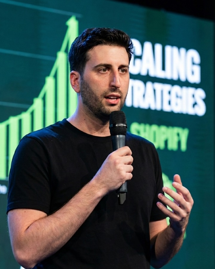 Steven Ellis on stage at a Shopify scaling event